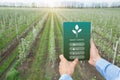 Farmer using SMART GARDEN app on touch pad for management, control and monitoring of crop growth