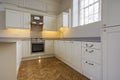 Contemporary fully fitted kitchen in beige Royalty Free Stock Photo