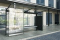 Contemporary glass bus stop with tree reflections and daylight. Transport and urban concept. Royalty Free Stock Photo