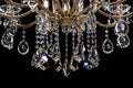 Contemporary gold chandelier isolated on black background. close-up . Crystal chandelier Royalty Free Stock Photo