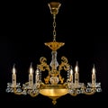 Contemporary gold chandelier isolated on black background. close-up . Crystal chandelier Royalty Free Stock Photo