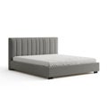 Modern Upholstered Platform Bed Frame with Vertical Channel Tufted Headboard and White Linens Royalty Free Stock Photo