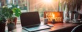 Contemporary home office setup with laptop on a modern desk, lightbox with Work from Home message, and houseplant, embodying Royalty Free Stock Photo