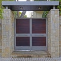 Contemporary house entrance natural wood and metal door, Athens Greece