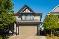 Contemporary house exterior in Vancouver Canada. Big modern house with beautiful landscaping and driveway to garage Royalty Free Stock Photo