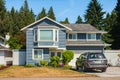 Contemporary house exterior in Vancouver Canada. Big modern house with beautiful landscaping and driveway to garage Royalty Free Stock Photo