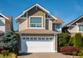 Contemporary house exterior in Vancouver Canada. Big modern house with beautiful landscaping and driveway to garage Royalty Free Stock Photo