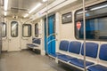 Contemporary inside space of the underground railway carriage with empty seats. Royalty Free Stock Photo