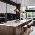 A contemporary kitchen with high-gloss cabinets, a breakfast bar, and pendant lights1 Royalty Free Stock Photo