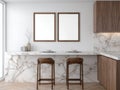 Modern Kitchen Interior With Two Wooden Bar Stools And Marble Countertop Displaying Two Blank Frames Royalty Free Stock Photo