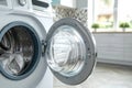 Contemporary Laundry Elegance: Open Door Washing Machine. Royalty Free Stock Photo