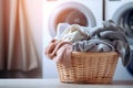 A contemporary laundry room adorned with a modern washing machine, dryer, and a wicker basket of clean clothes