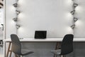 Contemporary light loft coworking office interior with lamps. Workplace concept. Royalty Free Stock Photo