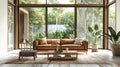 Spacious modern living room with large windows and natural views Royalty Free Stock Photo