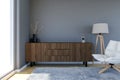 Contemporary living room interior with grey wall and large windows