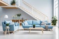 Contemporary living room with a large blue sofa and stylish wooden staircase Royalty Free Stock Photo