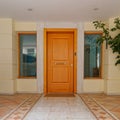 Contemporary luxury apartment building with classic design pavement entrance Royalty Free Stock Photo