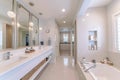 Contemporary luxury bathroom with lighting fixtures in all white