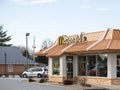 Contemporary McDonald`s exterior. The McDonald`s Corporation is the world`s largest chain of hamburger fast food restaurants.