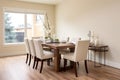 Contemporary minimalist dining room hardwood table with upholstered chairs on a hardwood laminate floor Generative AI