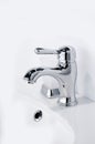 Contemporary new chrome bathroom faucet. Vertical photography Royalty Free Stock Photo