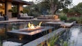 A contemporary outdoor lounge area featuring a fire table in the middle of a shallow pool creating a unique and Royalty Free Stock Photo