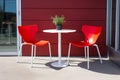 Contemporary outdoor patio bistro set with pops of red and white