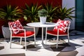 Contemporary outdoor patio bistro set with pops of red and white