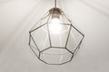 Contemporary pendant light made of metal. High-tech style interior concept