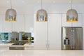 Contemporary pendant lights hanging over kitchen island Royalty Free Stock Photo