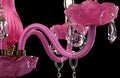 Contemporary pink glass chandelier isolated on black background. close-up chandelier. Royalty Free Stock Photo