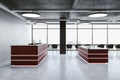 Contemporary reception table with computers on loft interior Royalty Free Stock Photo