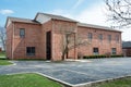 Contemporary Red Brick Building with Parking Lot