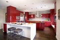 Contemporary red modern kitchen with 2 different island