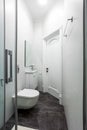 Contemporary small bathroom interior design. Glass shower cabin