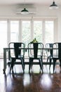 Contemporary vintage styled light bright dining room with bifold doors Royalty Free Stock Photo