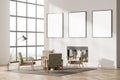 Contemporary white living room interior with fireplace, armchairs. Three posters in a row template mockup on wall. Big panoramic Royalty Free Stock Photo