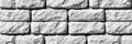 Contemporary White Stone Brick Wall Pattern with Rustic Charm for Indoor Home and Building Design Royalty Free Stock Photo