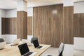 Contemporary wooden and concrete boarding room interior with furniture and equipment.