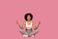 Content african american woman meditating in lotus pose Royalty Free Stock Photo