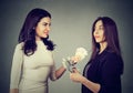 Content business women exchanging money Royalty Free Stock Photo