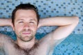 Content caucasian man in a swimming pool. Royalty Free Stock Photo