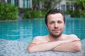 Content caucasian man in a swimming pool. Royalty Free Stock Photo