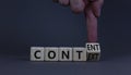 Content and context symbol. Businessman turns a wooden cube and changes the word context to content. Beautiful grey table, grey