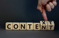 Content and context symbol. Businessman turns wooden cubes and changes the word context to content. Beautiful grey table, grey Royalty Free Stock Photo