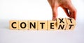 Content and context symbol. Businessman turns wooden cubes and changes the word context to content. Beautiful white table, white Royalty Free Stock Photo