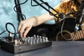 Close up of artist turning buttons, knobs and sliders on sound controller Royalty Free Stock Photo