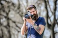 Content creator. Man bearded hipster photographer. Photographer with beard and mustache. Man with long beard shooting