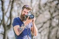 Content creator. Man bearded hipster photographer. Photographer with beard and mustache. Man with long beard shooting