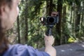 Young man filming with a camera gimbal Royalty Free Stock Photo